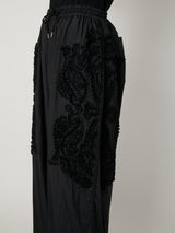 SCULPTURAL EMBROIDERY TRACK PANTS - TAAKK
